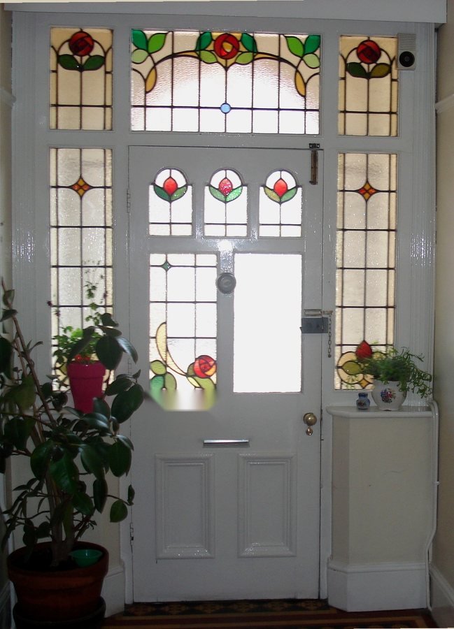 The original stained-glass front door at Open Hands Coventry